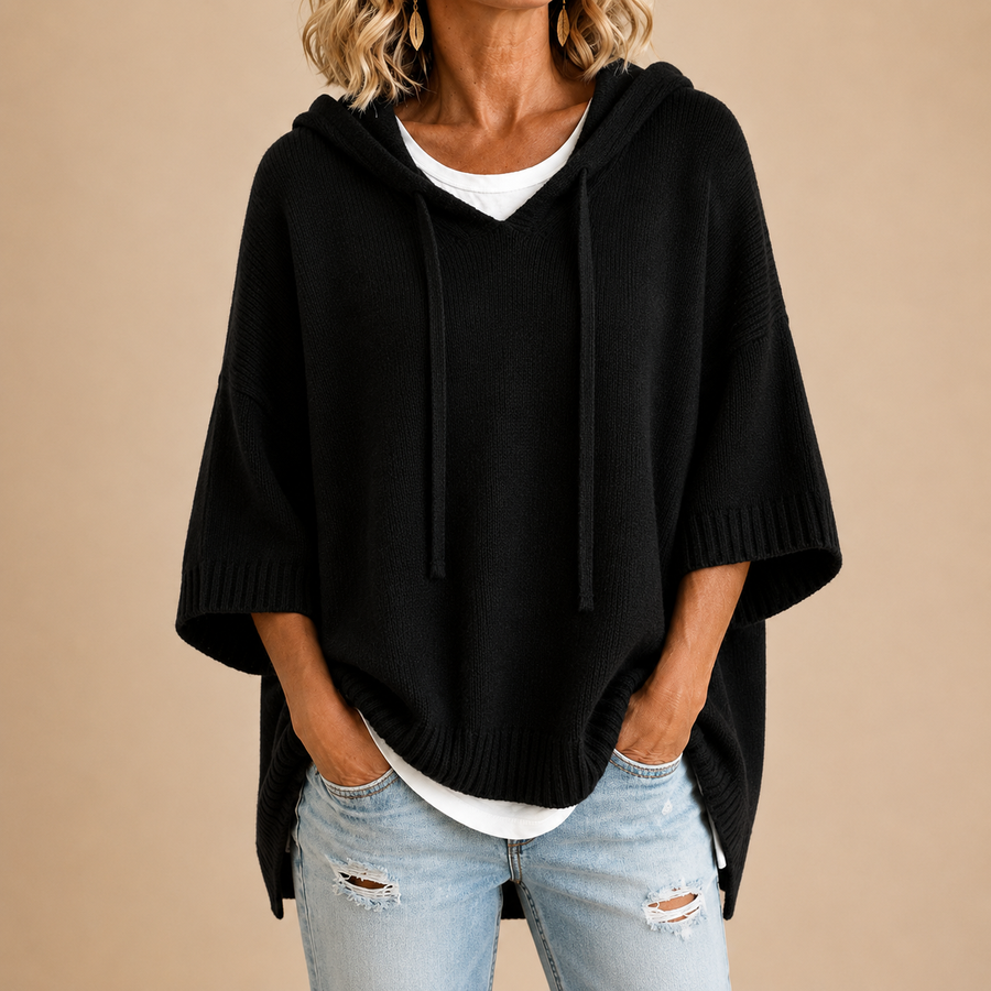 Orielle | Poncho-style knitted sweater with hood and three-quarter sleeves.